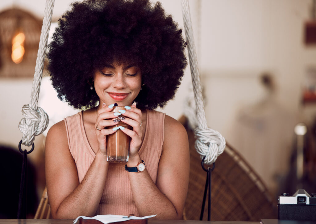 black-woman-happy-and-relax-at-cafe-with-aroma-of-2023-11-27-04-54-02-utc-1024x725.jpg